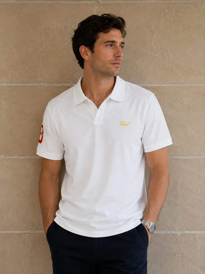 Men wearing a white short sleeve polo shirt